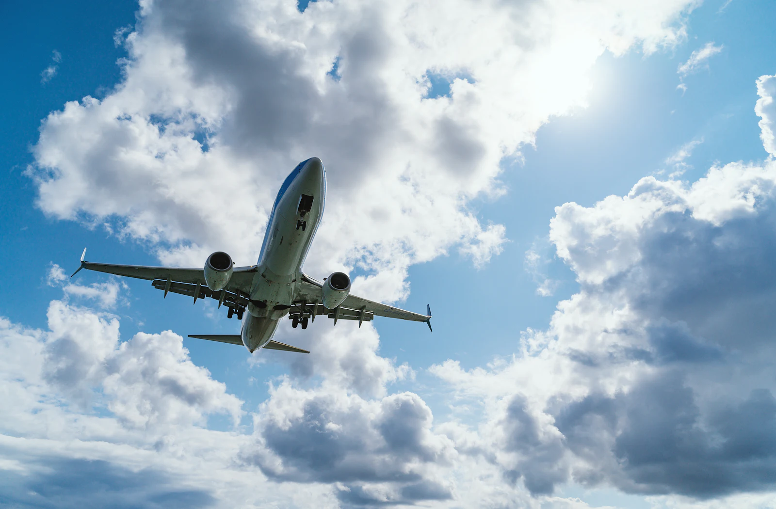 Cargo aircraft climbing through clouds