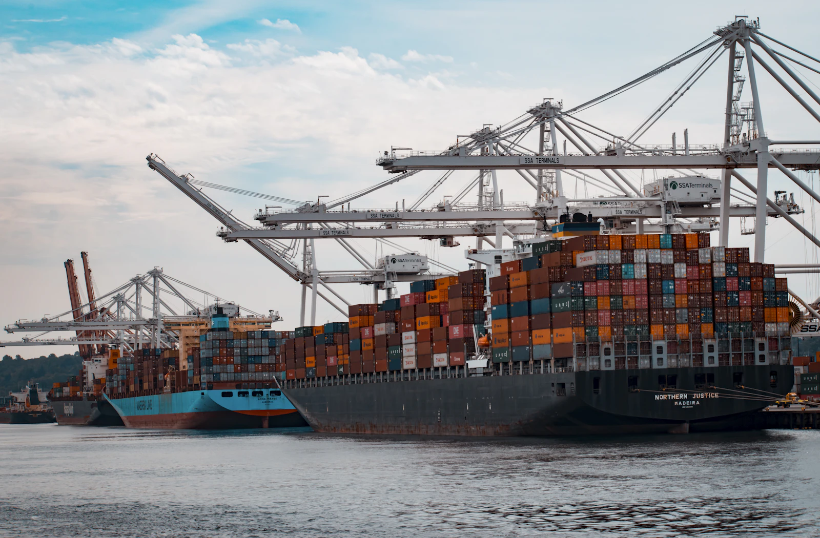 Container vessel loaded with shipping containers at a port terminal