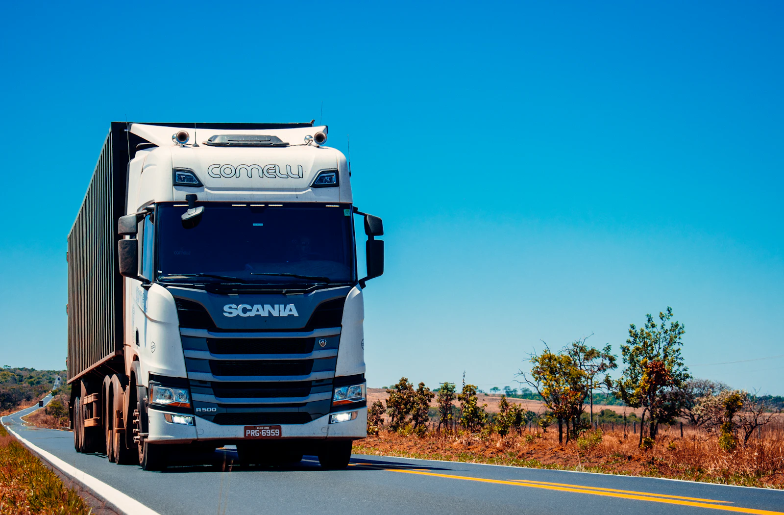 Semi-truck hauling a freight trailer on an open highway
